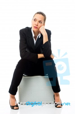 Woman Sitting On Briefcase Stock Photo