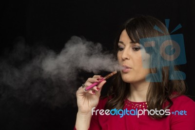 Woman Smoking A Electronic Cigarette Stock Photo