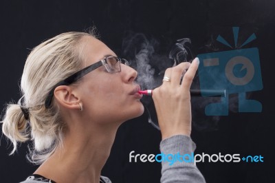 Woman Smoking E-cigarettete Stock Photo