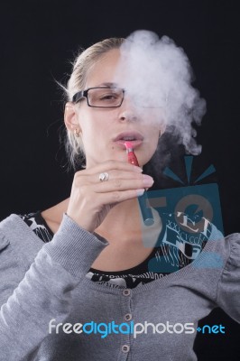 Woman Smoking E-cigarettete Stock Photo