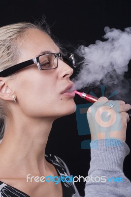 Woman Smoking E-cigarettete Stock Photo