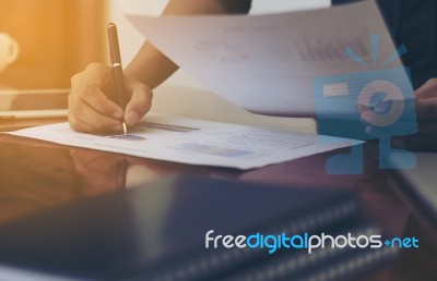 Woman Standing And Writing Document Hand  At Desk Stock Photo