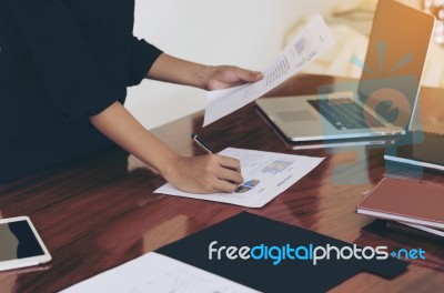 Woman Standing And Writing Document Hand Close Up At Desk Stock Photo