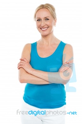 Woman Standing With Arms Crossed Stock Photo