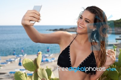 Woman Take A Selfie On A Beach Stock Photo