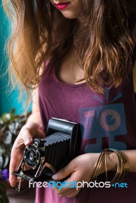 Woman Taking Picture With Retro Camera Stock Photo