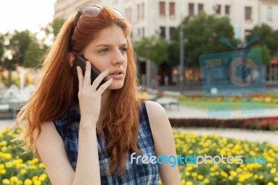 Woman Talking On The Phone Stock Photo