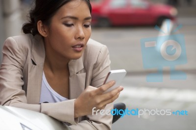 Woman Texting On The Phone Stock Photo