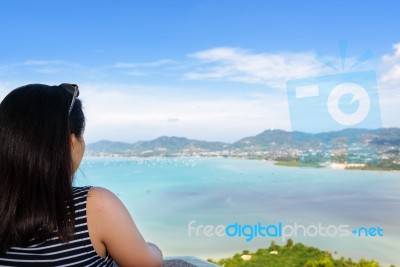 Woman Tourist Watching The Ocean In Phuket, Thailand Stock Photo