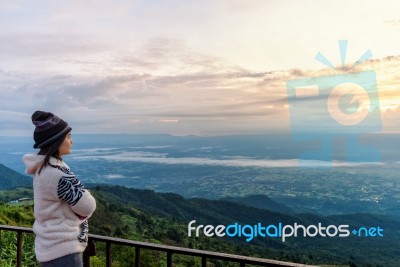 Woman Tourist Watching The Sunrise Stock Photo