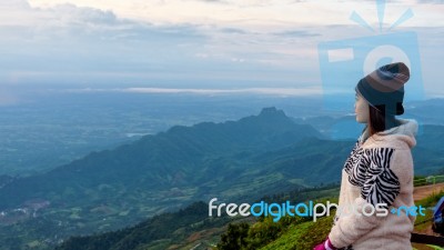 Woman Tourist Watching The Sunrise Stock Photo