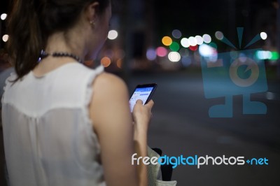 Woman Use Of Cellphone At Outdoor Stock Photo