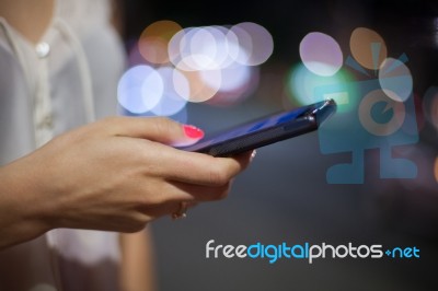 Woman Use Of Cellphone At Outdoor Stock Photo