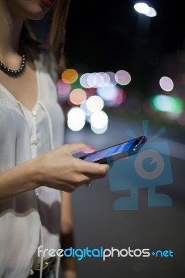 Woman Use Of Cellphone At Outdoor Stock Photo