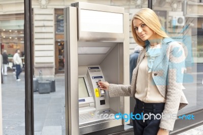 Woman Using Bank ATM Machine Stock Photo