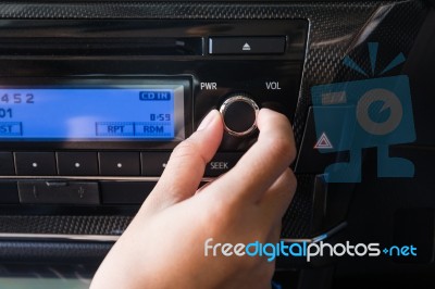 Woman Using Car Volume Audio Control Stock Photo