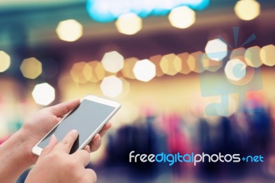 Woman Using Smart Phone On Night Street Stock Photo