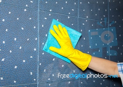 Woman Washes A Tile In The Bathroom Stock Photo