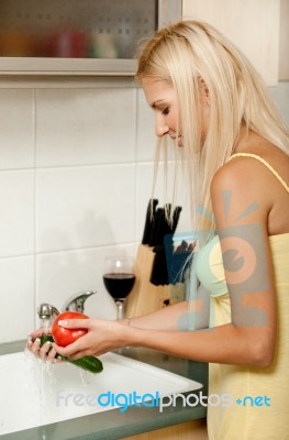 Woman Washing Vegetables Stock Photo