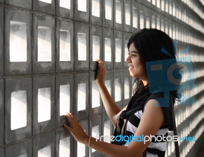 Woman With A Sad Expression On A Dramatic Background Stock Photo