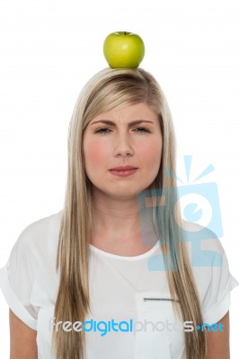 Woman With Apple On Her Head Stock Photo