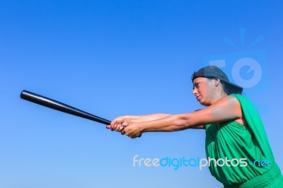 Woman With Baseball Bat Body Posture To Strike Stock Photo