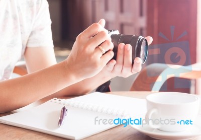 Woman With Camera In The Hands Stock Photo