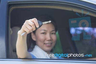 Woman With Car Key Stock Photo