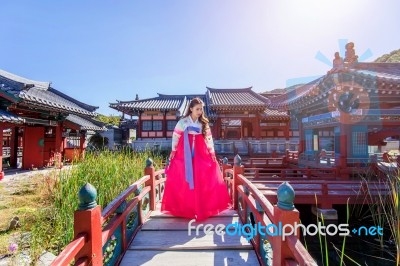 Woman With Hanbok In Gyeongbokgung,the Traditional Korean Dress Stock Photo