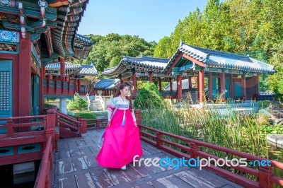 Woman With Hanbok In Gyeongbokgung,the Traditional Korean Dress Stock Photo