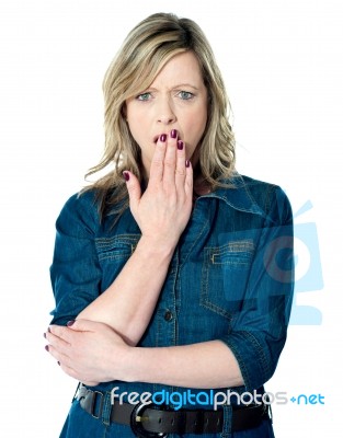 Woman With Hand Over Mouth Stock Photo