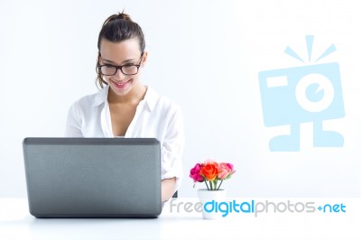 Woman With Laptop Working At Home Stock Photo