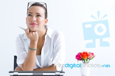 Woman With Laptop Working At Home Stock Photo