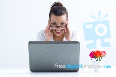 Woman With Laptop Working At Home Stock Photo