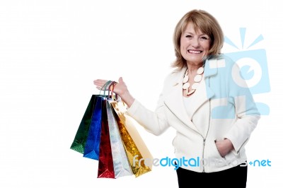 Woman With Shopping Bags On White Background Stock Photo