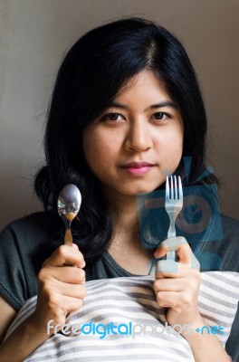 Woman With Spoon And Fork Stock Photo