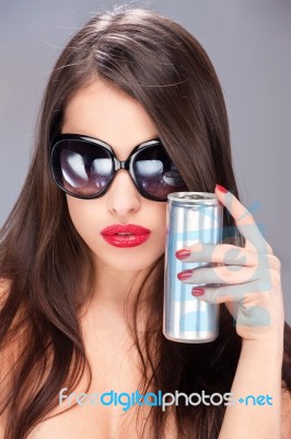 Woman With Sun Glasses Holding Can Stock Photo