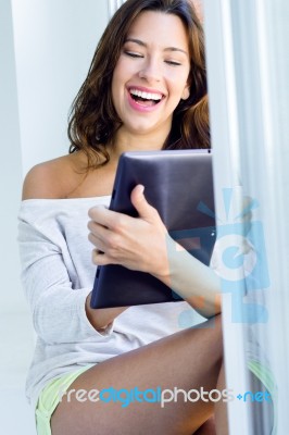 Woman With Tablet At Home Stock Photo