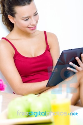 Woman With Tablet At Home Stock Photo