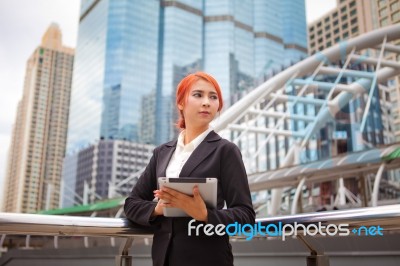 Woman With Tablet At Modern City Stock Photo