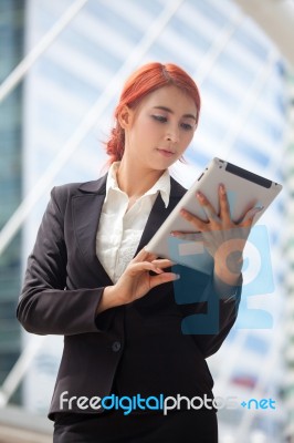 Woman With Tablet At Modern City Stock Photo