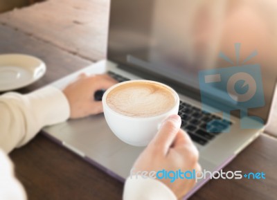 Woman Working With Laptop And Hot Coffee Stock Photo