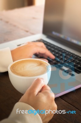 Woman Working With Laptop And Hot Coffee Stock Photo