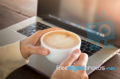 Woman Working With Laptop And Hot Coffee Stock Photo