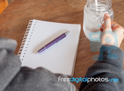 Woman's Hand Holding A Cold Glass Of Water Stock Photo