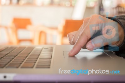 Woman's Hand Using Touch Pad Of Laptop Stock Photo