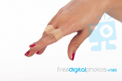 Woman's Hand With Plaster Stock Photo