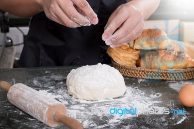 Woman's Hands Knead Dough With Flour, Eggs And Ingredients. At K… Stock Photo