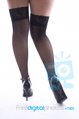 Woman's Legs With Fishnet Stockings Stock Photo