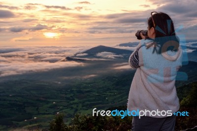 Women Are Shooting Sunrise Stock Photo